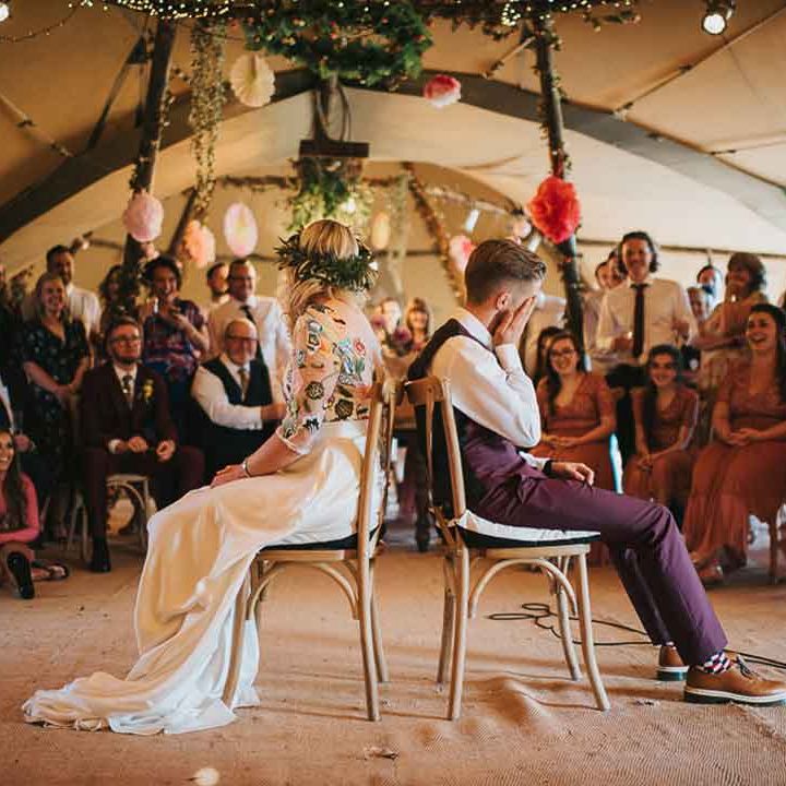 Bride and groom playing Mr and Mrs wedding game - how to say no kids at wedding 