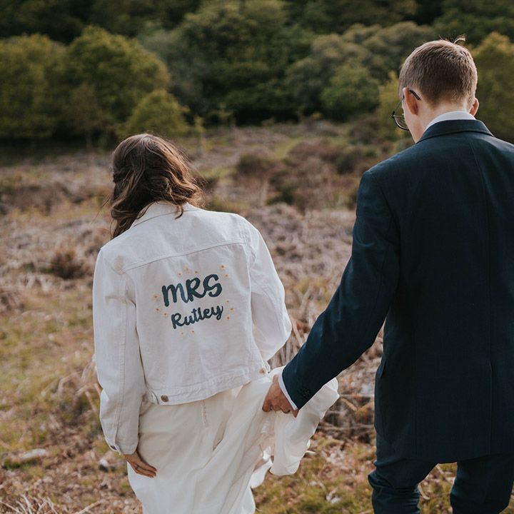DIY wedding denim jacket with personalised new last name on the back of the jacket 