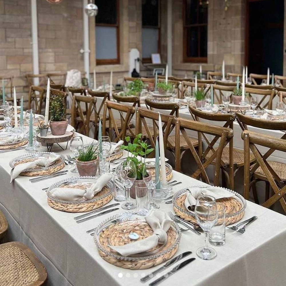 Cambo House Scottish wedding venue reception room with suspended foliage decor, disco ball decor, modern rustic wedding tablescapes and burlap place mats