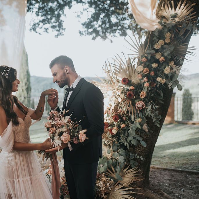 Groom kissing his brides hand at intimate 2020 elopement 