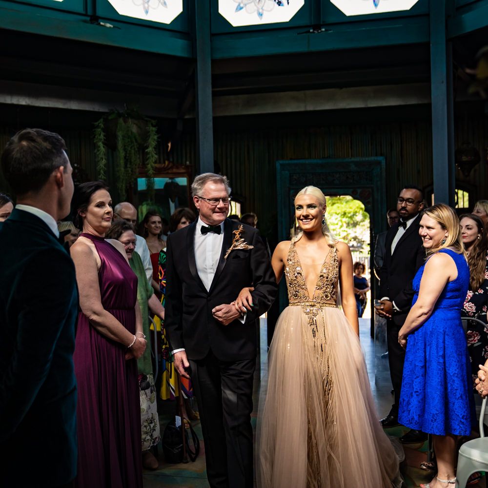 Bride walks down the aisle to see her groom 