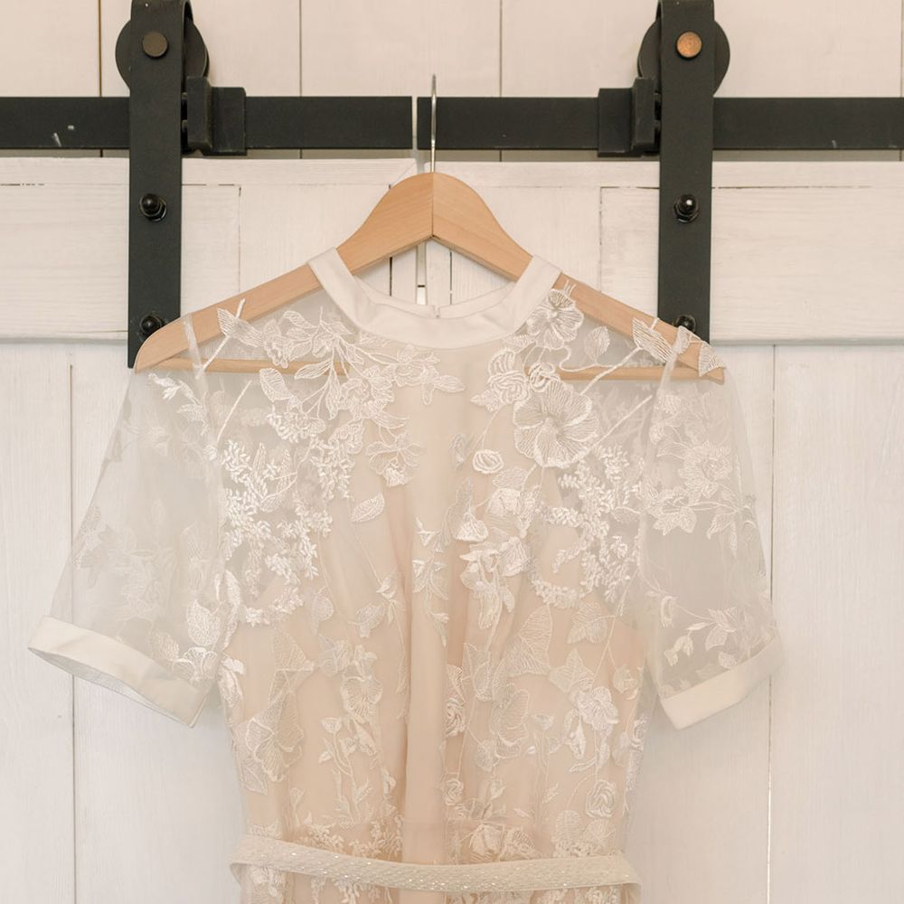 Appliqué lace Phase Eight wedding dress with short sleeves