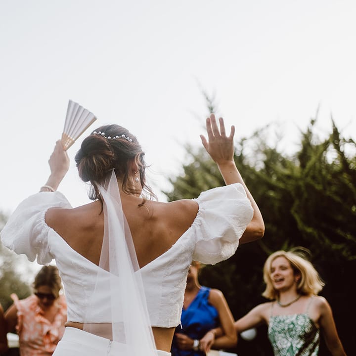 Bride dancing to celebrate her marriage