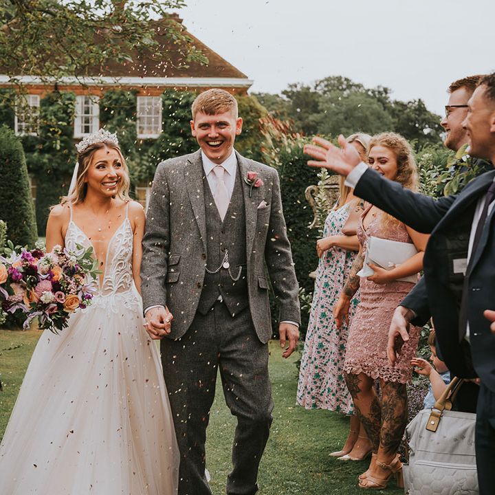 Bride and groom have their confetti exit