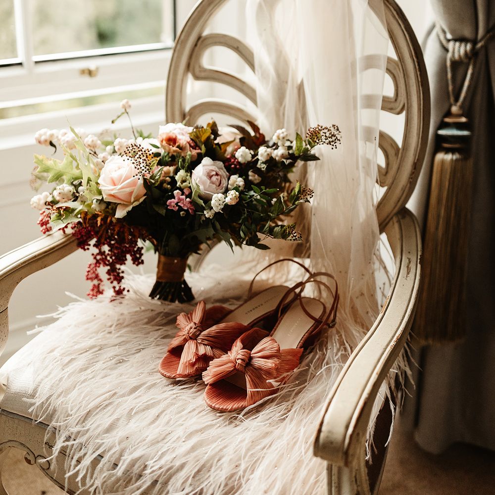 Rose and autumnal flower bouquet with Loeffler Randall wedding shoes with bow and veil 