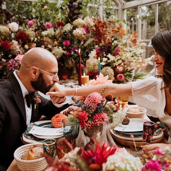 Bride and groom sharing intimate wedding dinner at Le Manoir Aux Quat Saisons - luxurious intimacy