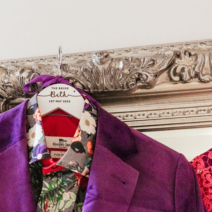Purple velvet bridal blazer with grey shirt with colourful floral and foliage patterns 