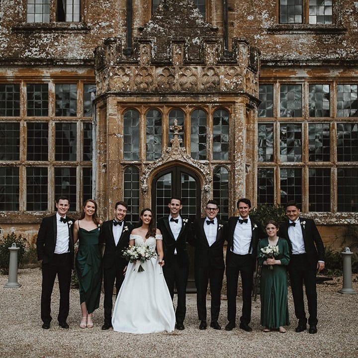 Bride and groom with their wedding party with a man of honour and groomswoman 