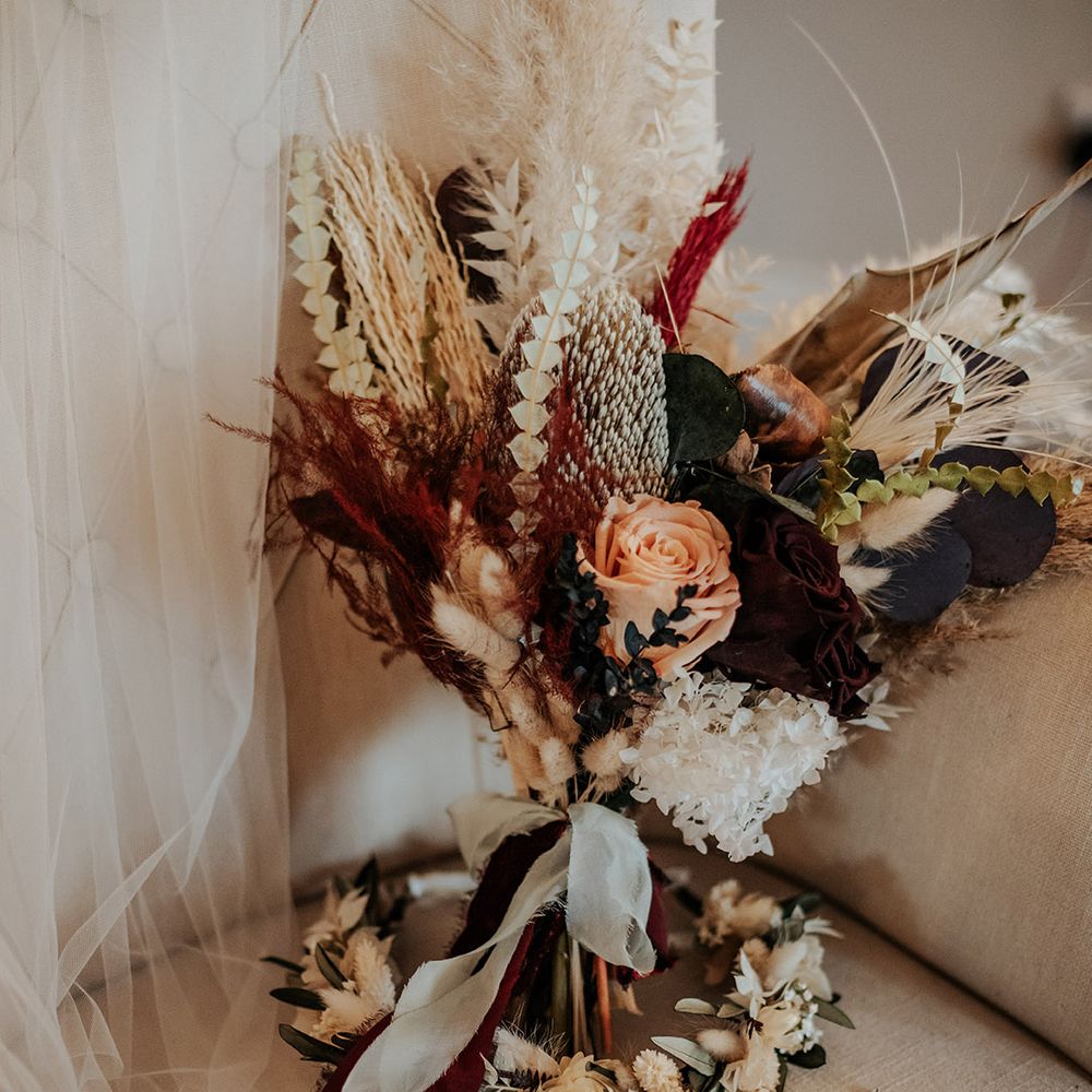 Autumnal boho dried flower wedding bouquet with dried flower crown by Luna and Wild for the bride 