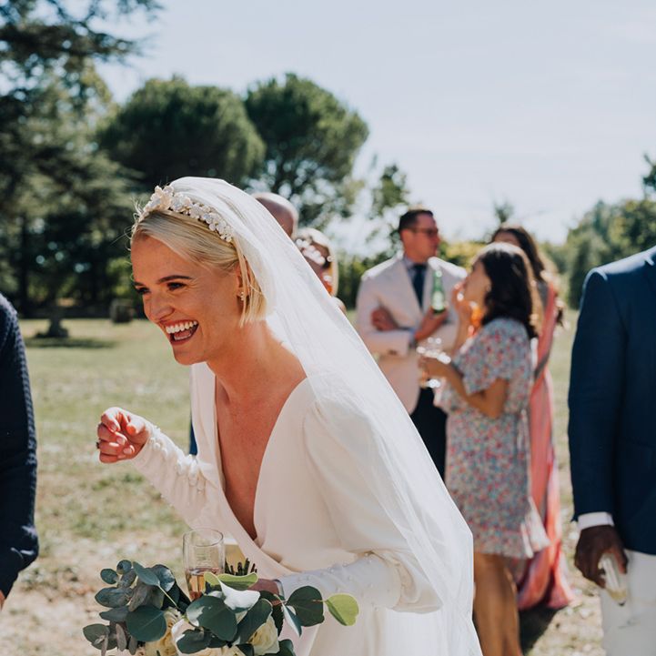 floaty Emma Beaumont wedding dress with long sleeves for destination wedding 