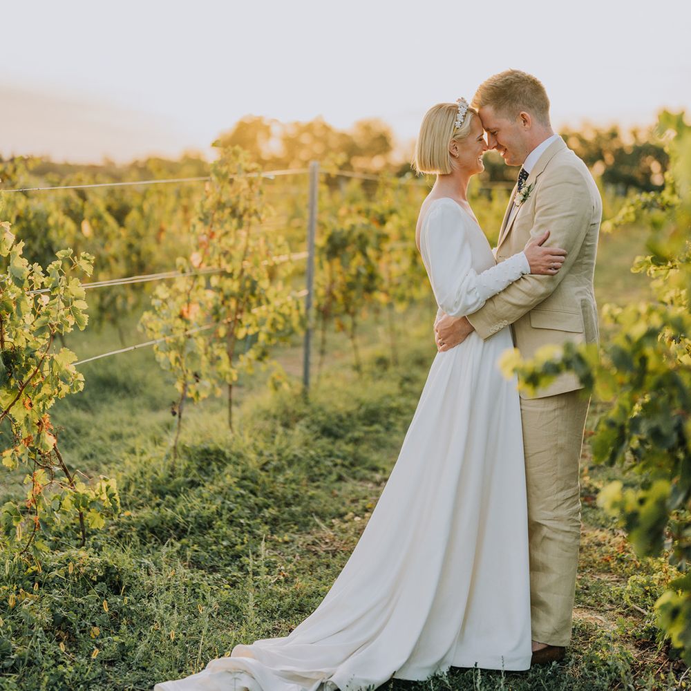 golden hour bride and groom photographs at Château de Malliac with bride in a Emma Beaumont wedding dress and groom in a beige suit