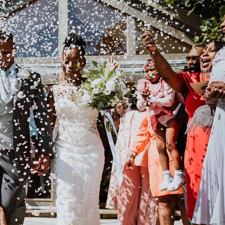 Bride and groom doing biodegradable wedding confetti exit at Tredudwell Manor 