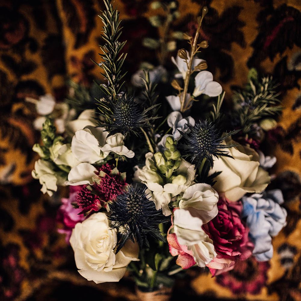 Rose and thistle wedding bouquet for the brides traditional church wedding ceremony and at home reception 