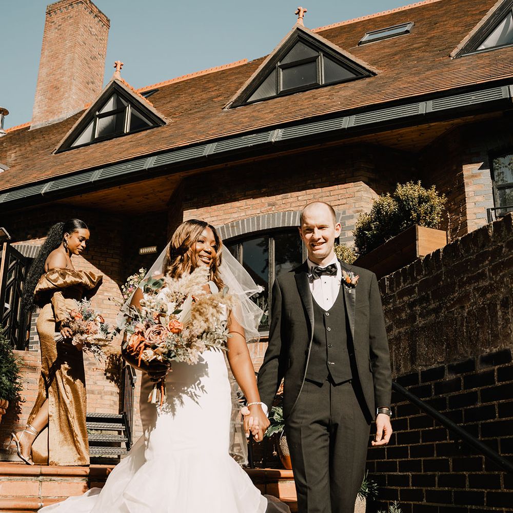 Bride in mermaid style wedding dress with the groom in a black tuxedo at Northern Ireland wedding 