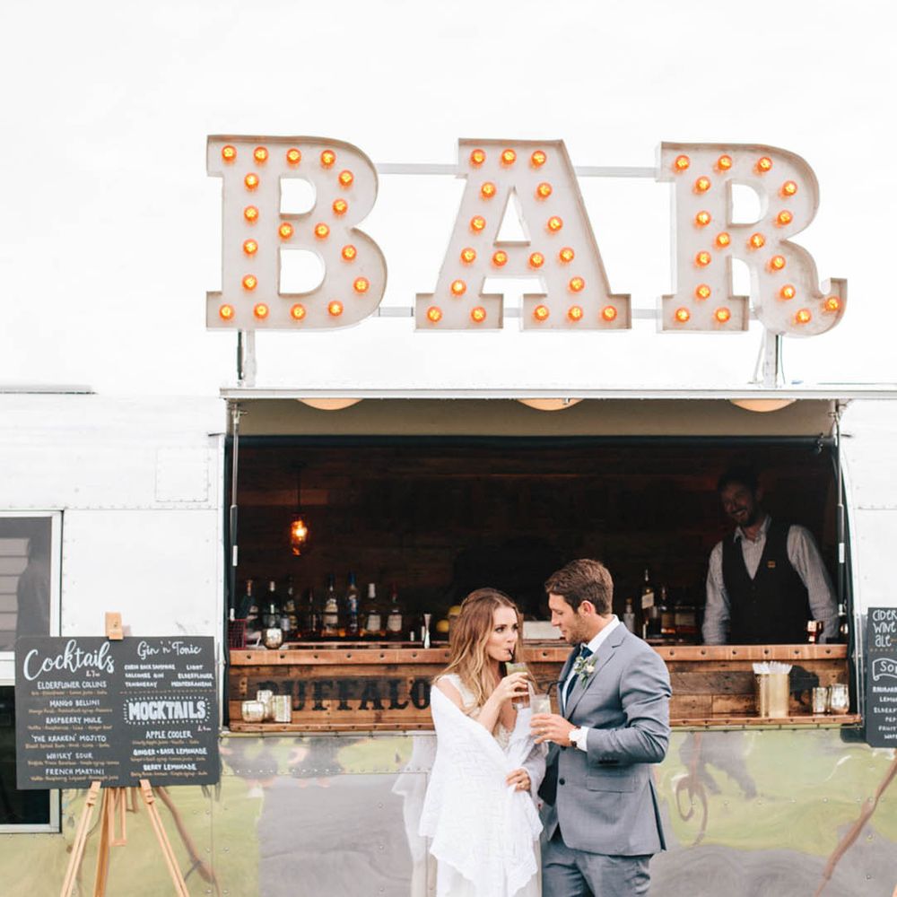 Wedding bar design ideas with large light up bar sign and chalk board menu signs