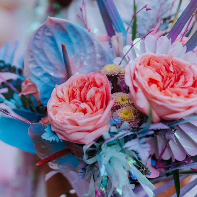 Bouquet with iridescent Anthuriums, roses and spray painted grasses  