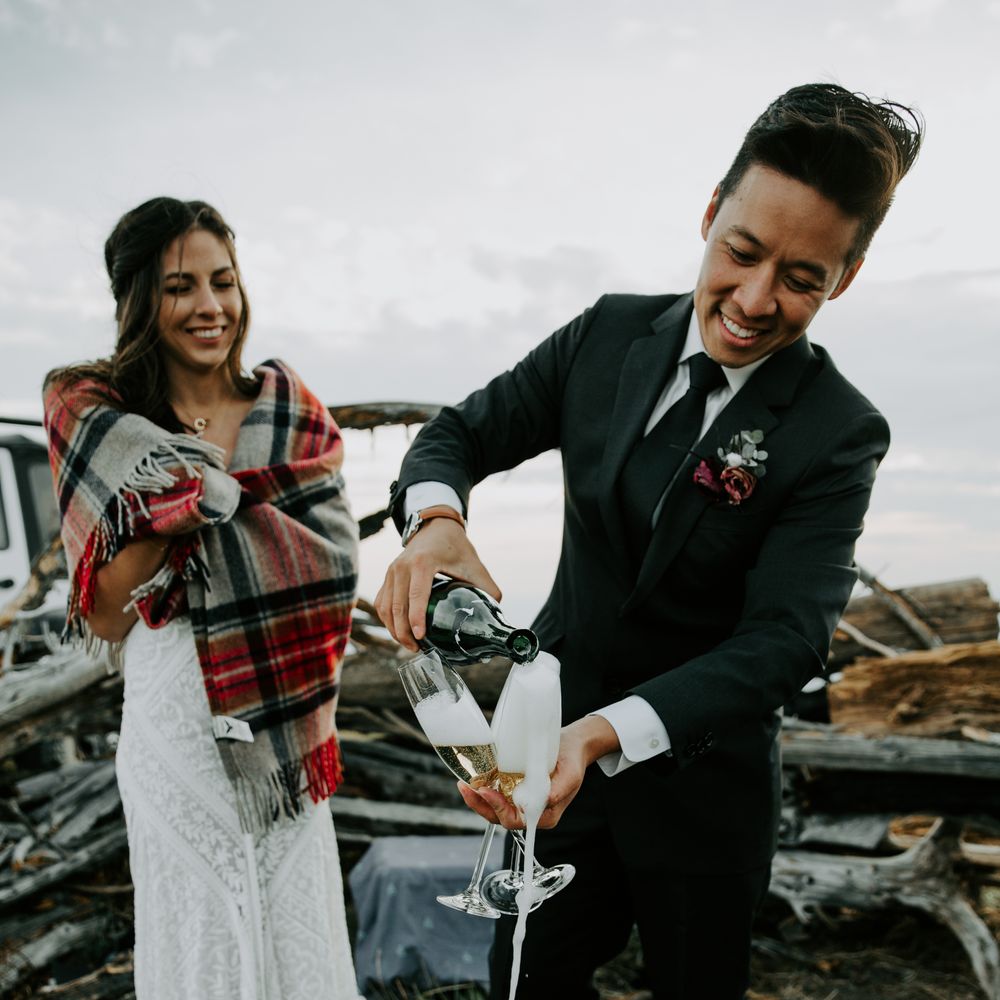 Groom pours champagne for wedding guests on the day of wedding