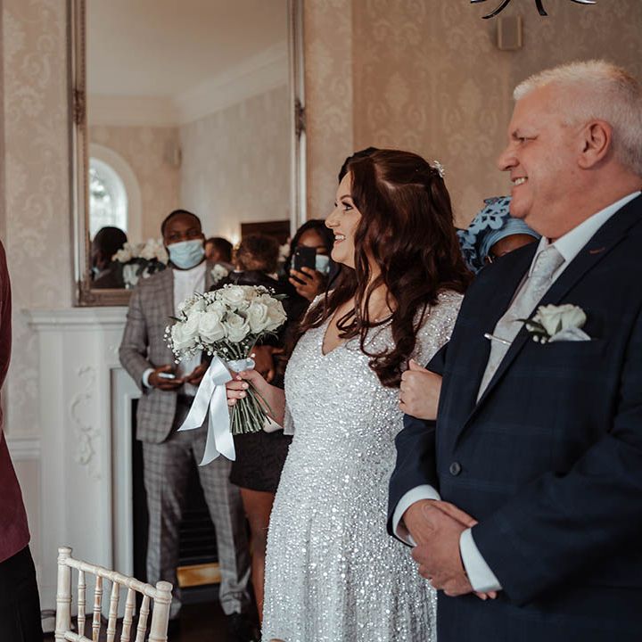 Bride & groom look lovingly at one another on their wedding day