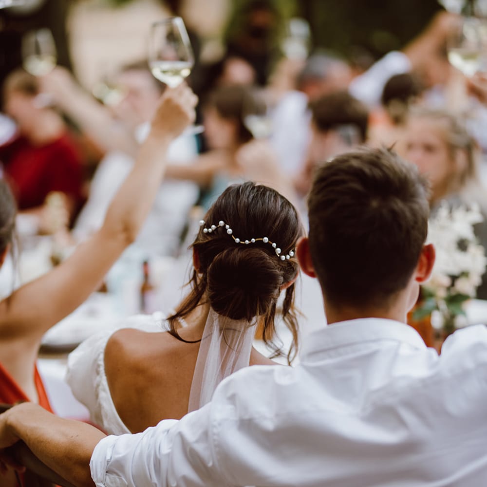 Bride and groom seated at dinner