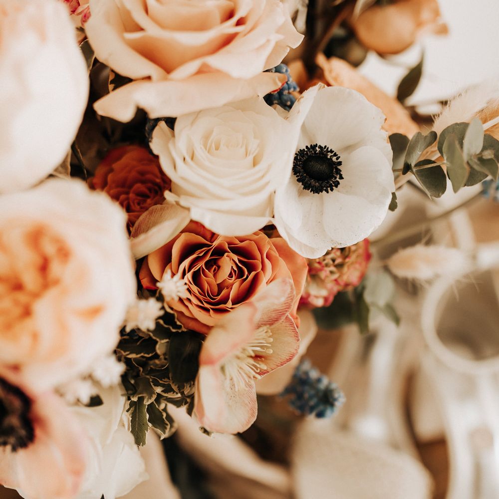 Mixed pastel wedding bouquet with roses and anemones 