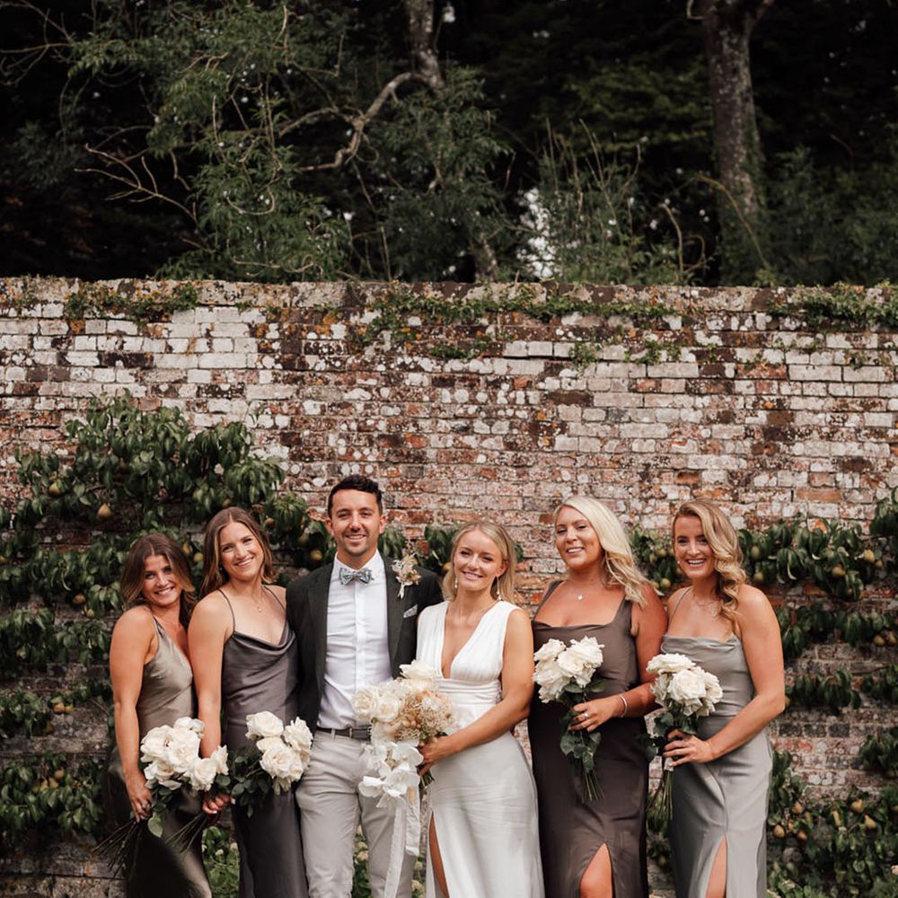 Mixed gender wedding party with the bride for the boho luxe wedding at Pythouse Kitchen Gardens