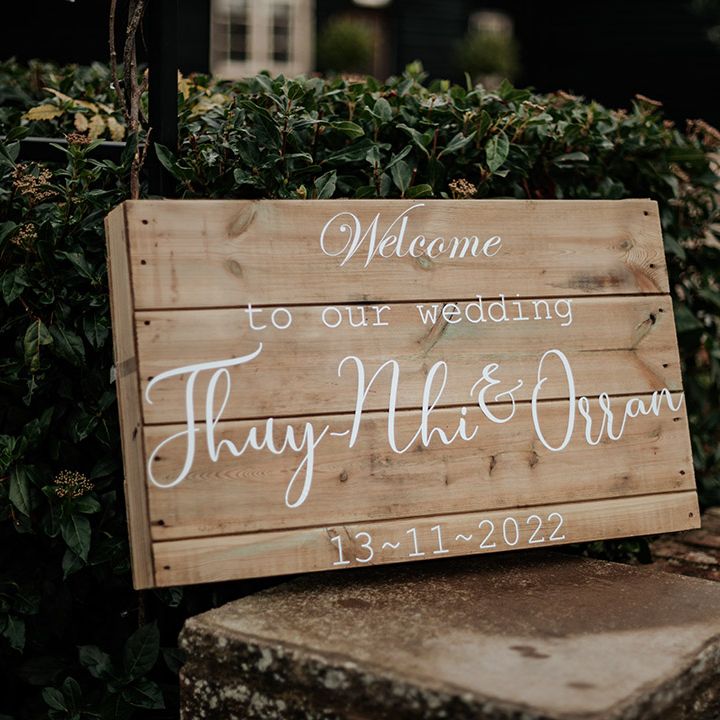 DIY wooden wedding welcome sign for a boho wedding with lots of personal touches 