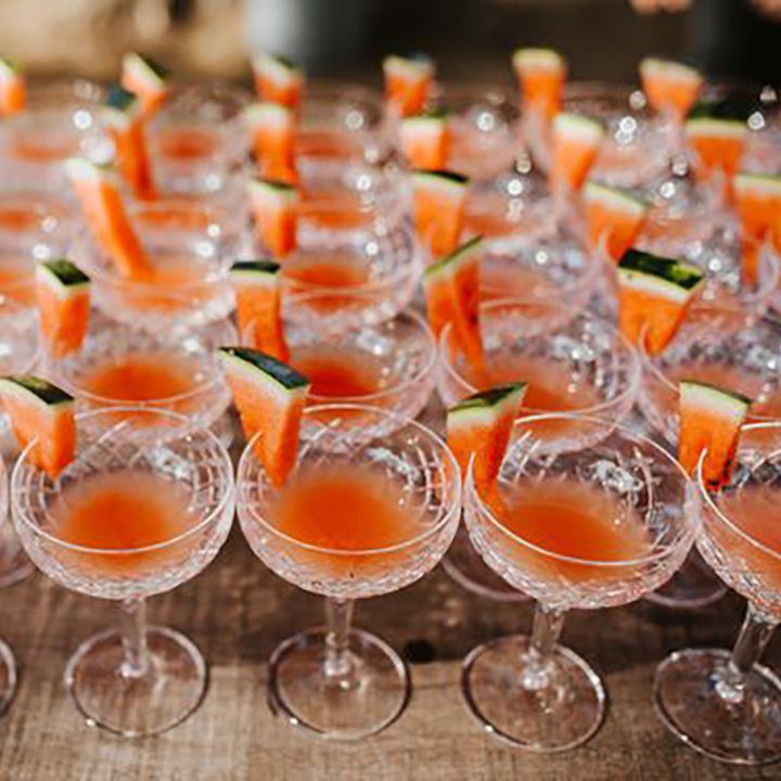 Image of lots of melon flavoured cocktails at a wedding, image by Colin Ross Photography