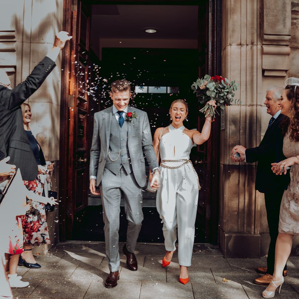 Small Town Hall micro wedding confetti exit with bride in Massimo Dutti jumpsuit 