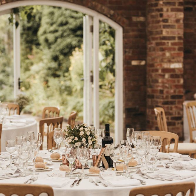 DIY flower centrepiece decor at Northbrook Park wedding reception 