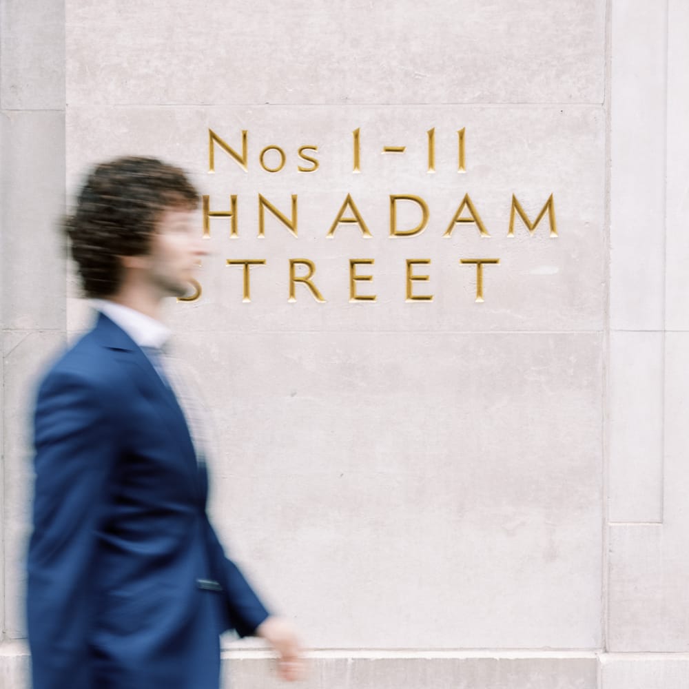 Blurred image of groom walking outdoors 