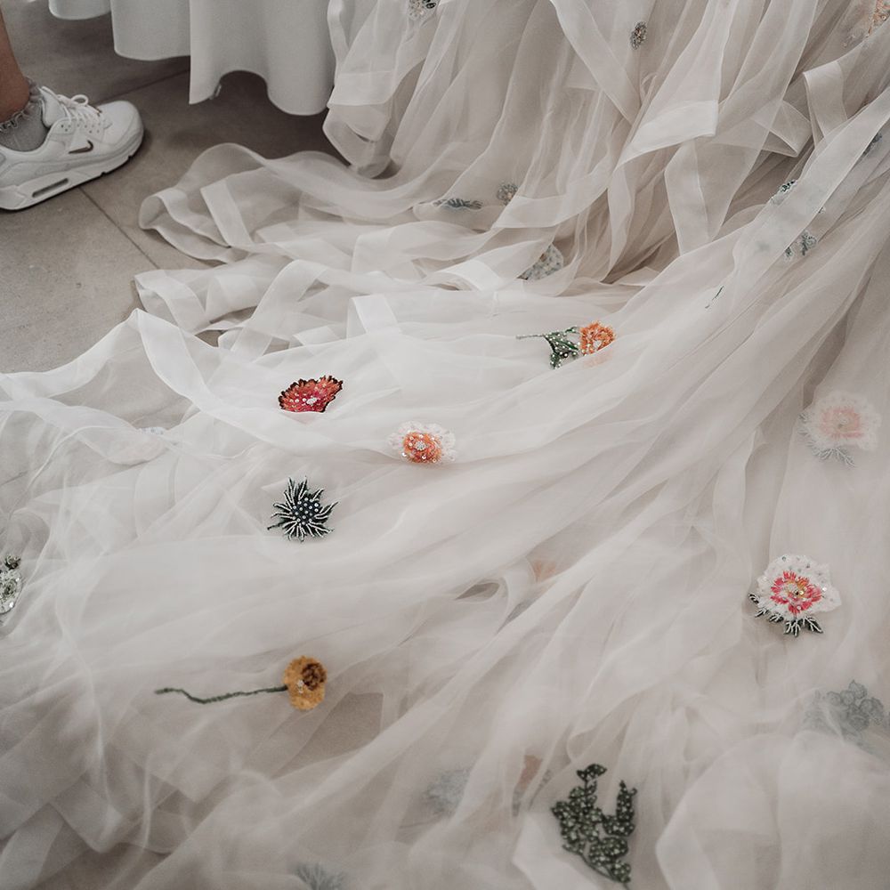 Mesh train of Victoria Sanders wedding dress with embroidered flowers 