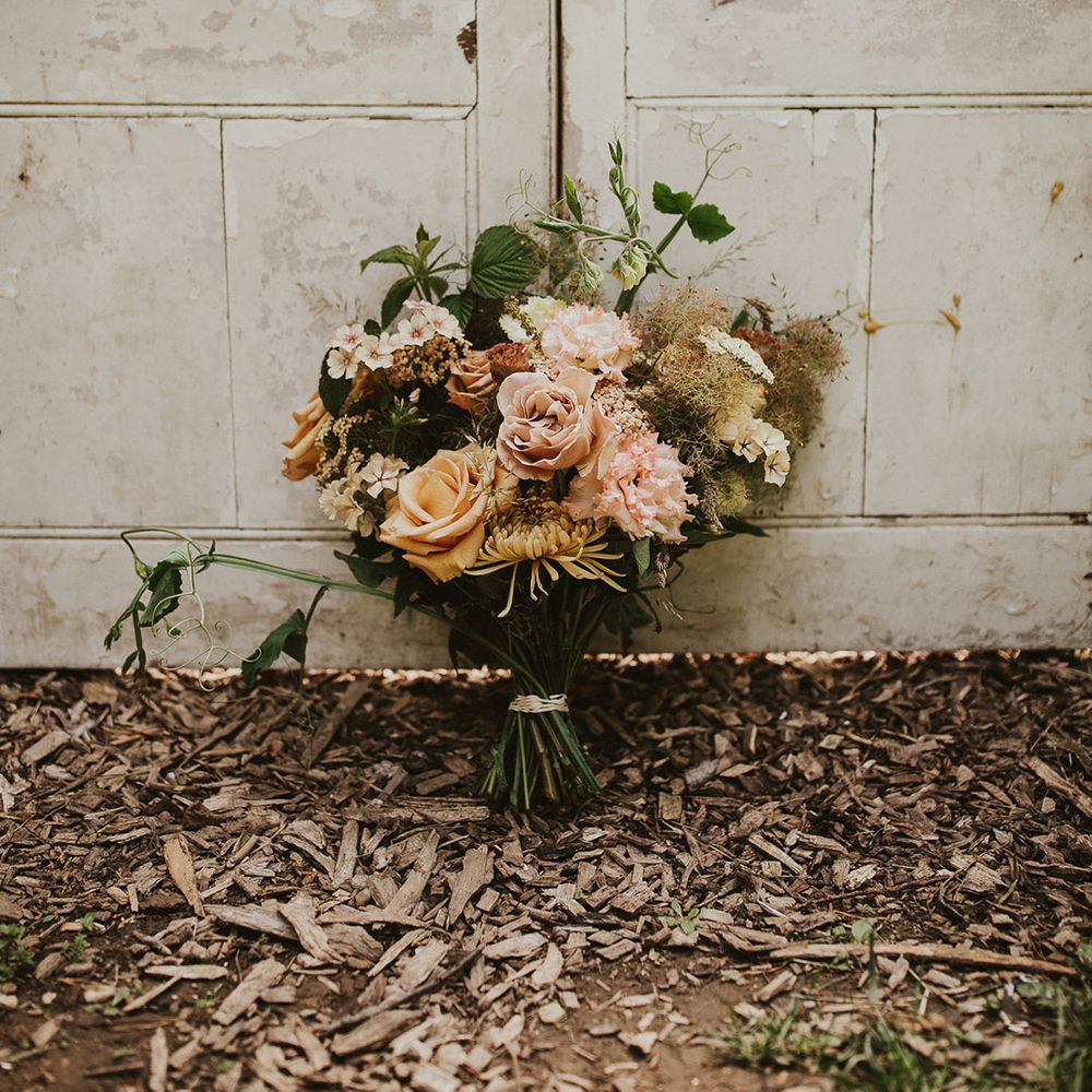 Pale dusty pink and rust rose bouquet for rustic wedding at Nancarrow Farm 