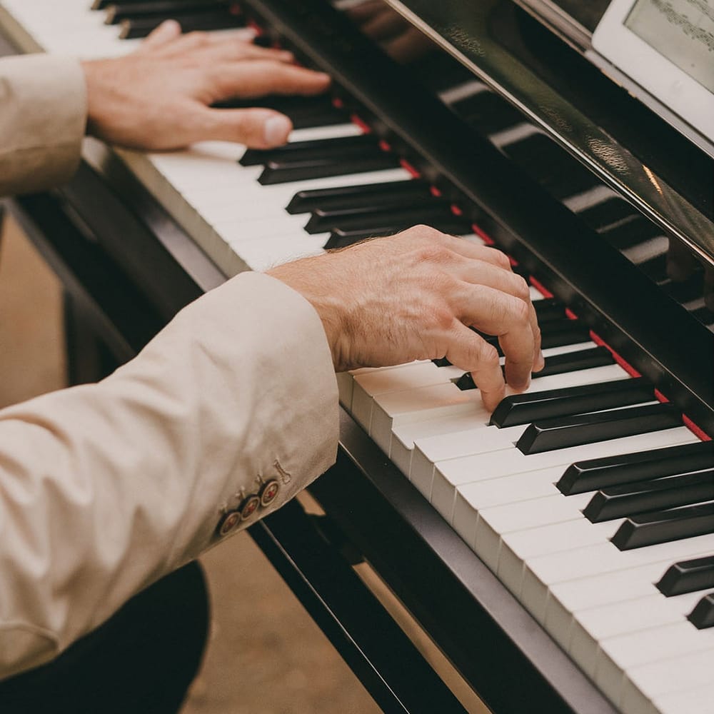 wedding pianist playing during the wedding ceremony 