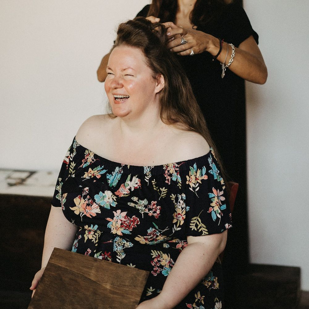 Tuscany bride having her long hair styled