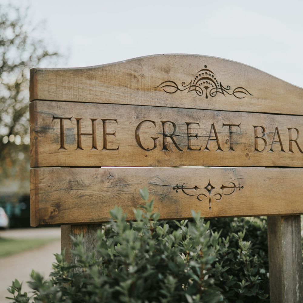 Wooden signage outside wedding venue