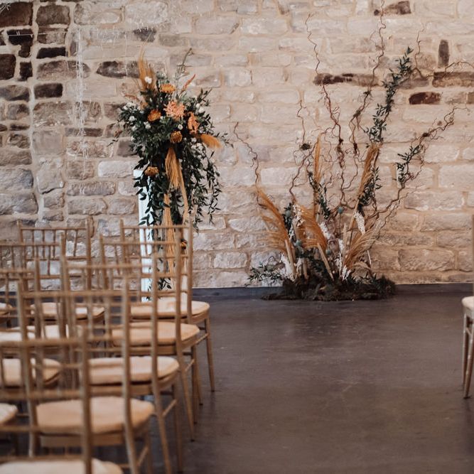 Asile at Ponden Mill with orange and green altar floral arrangements 