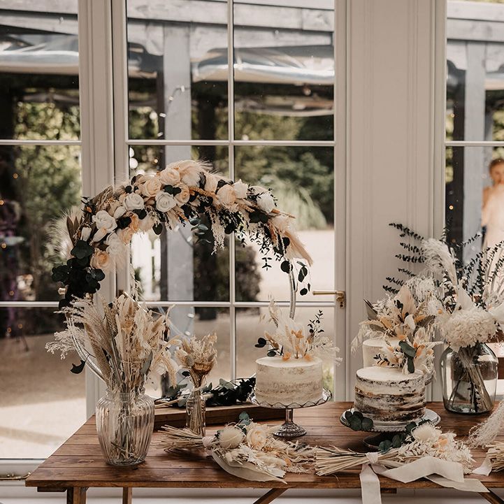 Dried floral arrangements on wooden table