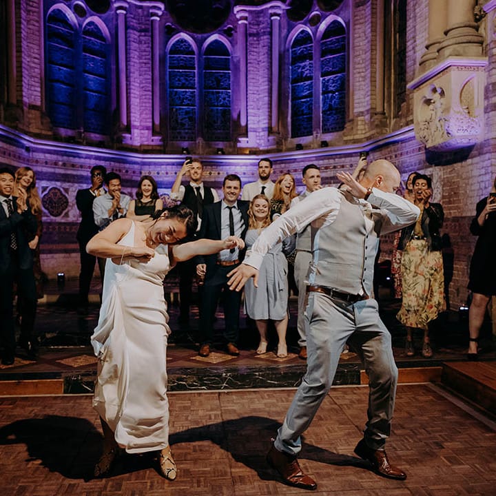 Bride & groom dance on their wedding day during reception 