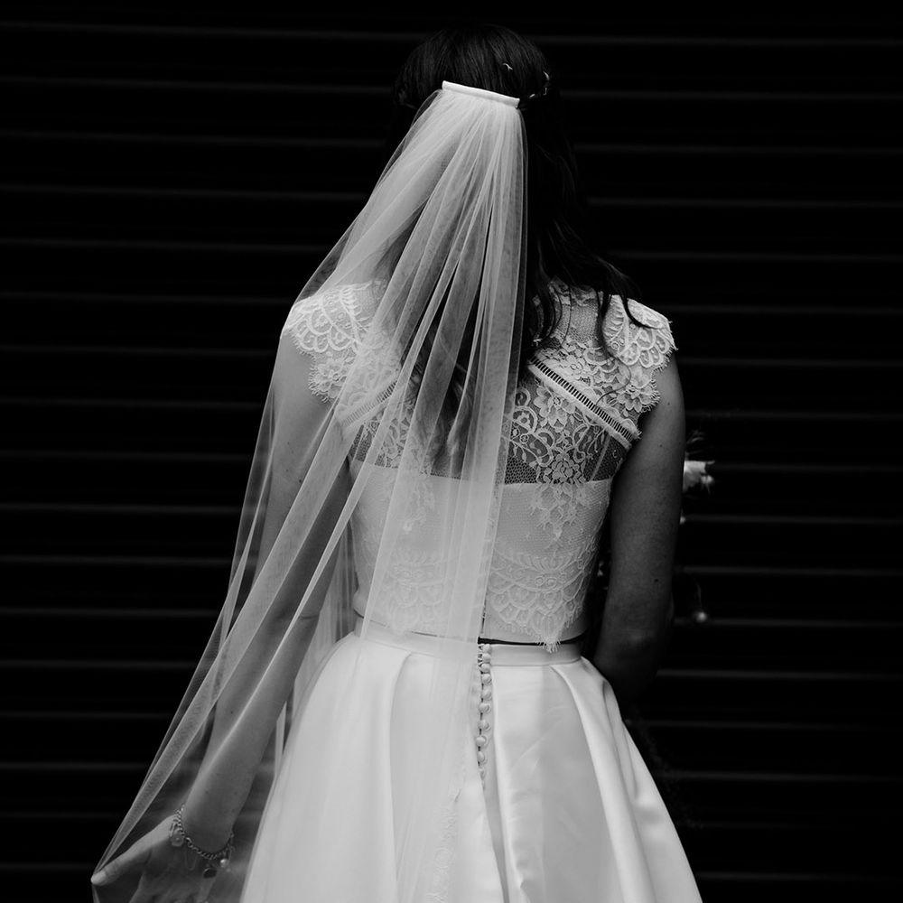 Buttoned lace wedding top and pleated skirt set with long lace veil 