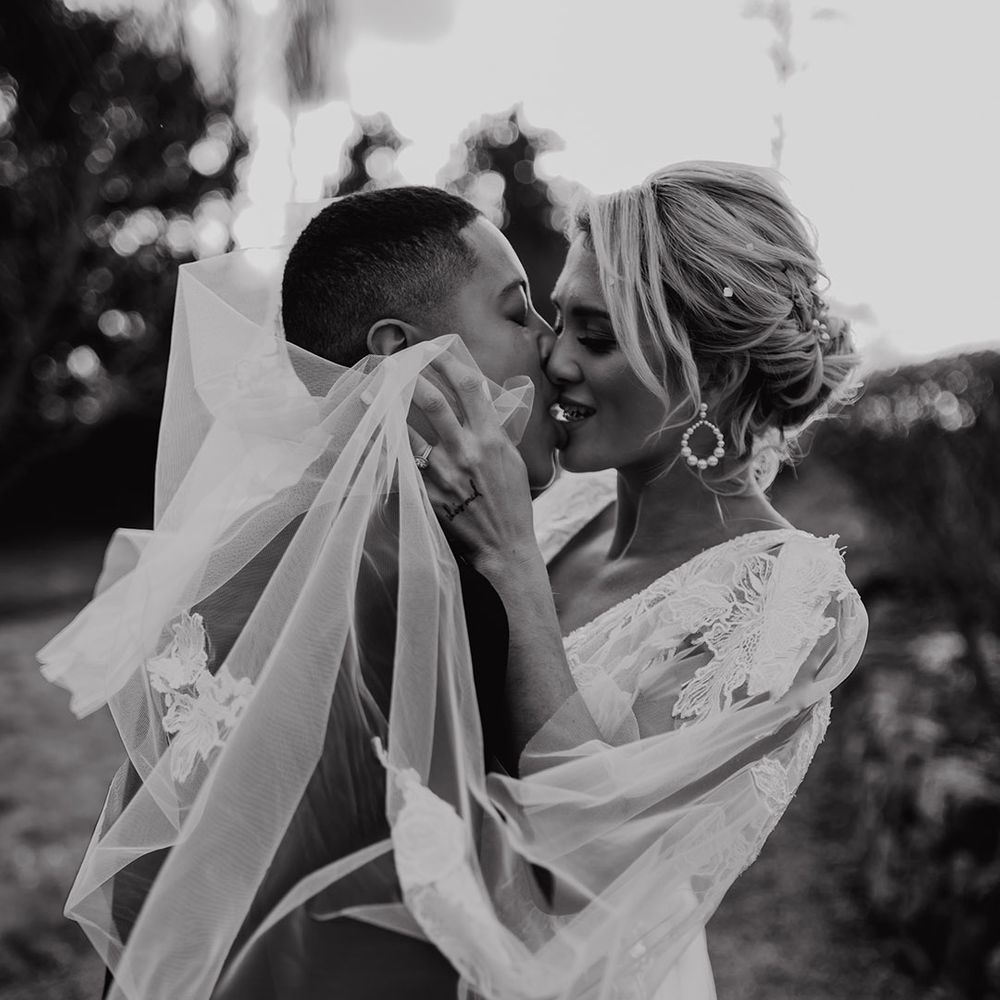 Intimate black and white wedding photograph of an LGBTQI+ couple at Hodsock Priory 