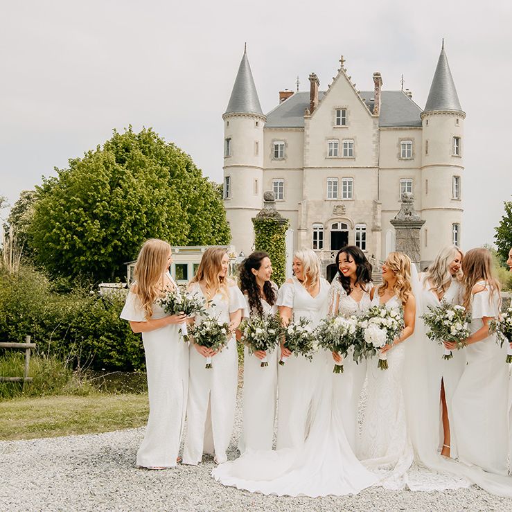 Brides in lace wedding dresses with trains and bridesmaids in sparkly front slit dresses 