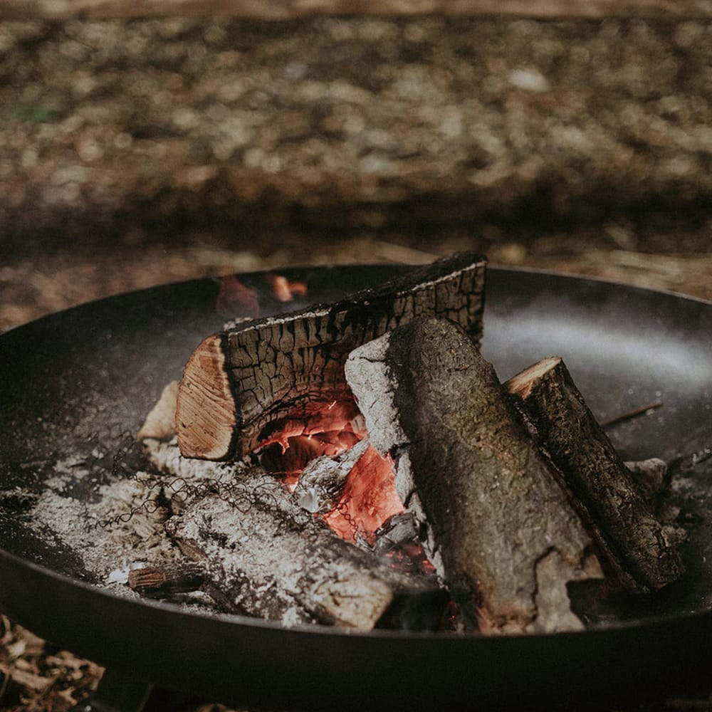 Outdoor fire pit at woodland wedding 
