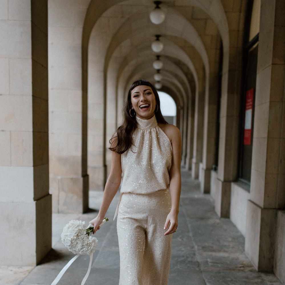 Stylish bride in sequin 'Solange Separates' holding a white hydrangea bouquet by Moon Child Bridal and Jean Jackson Couture 