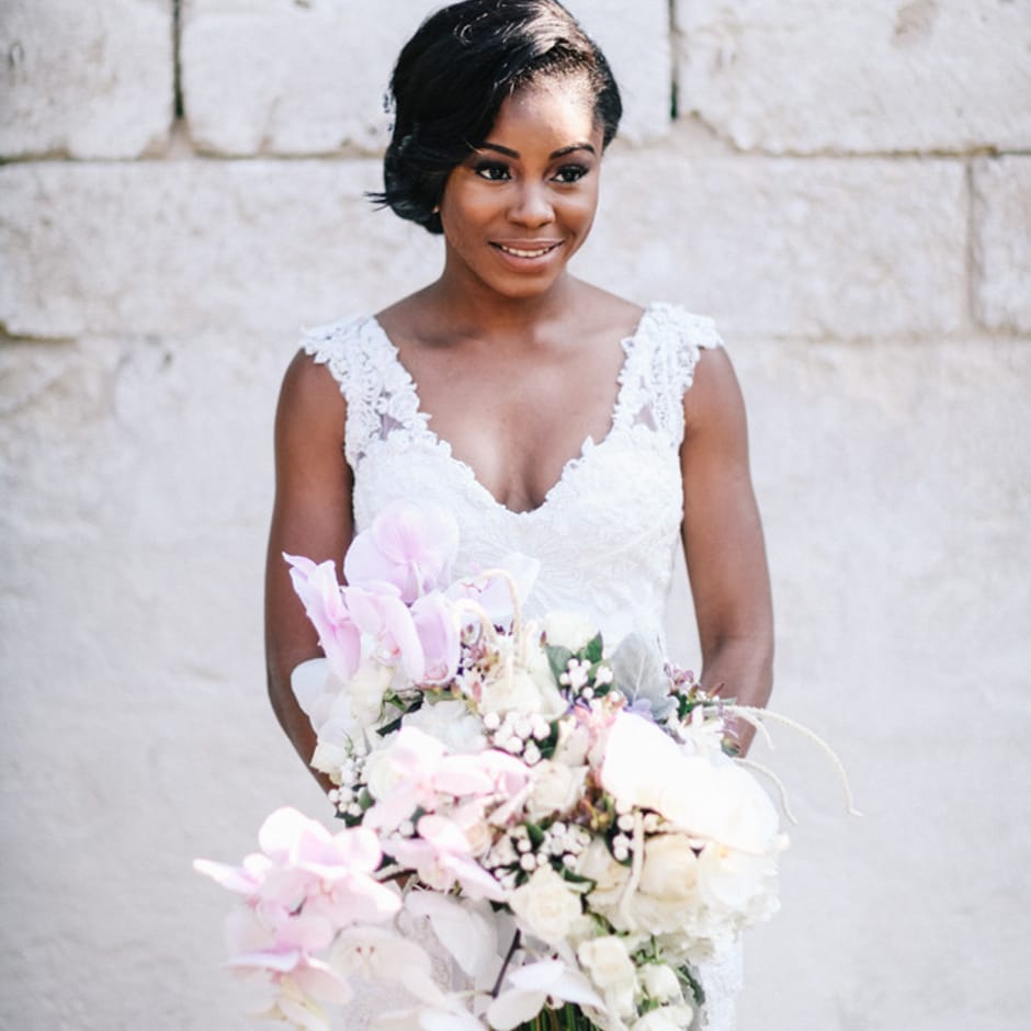 Bride holding bouquet for outdoor wedding in Italy