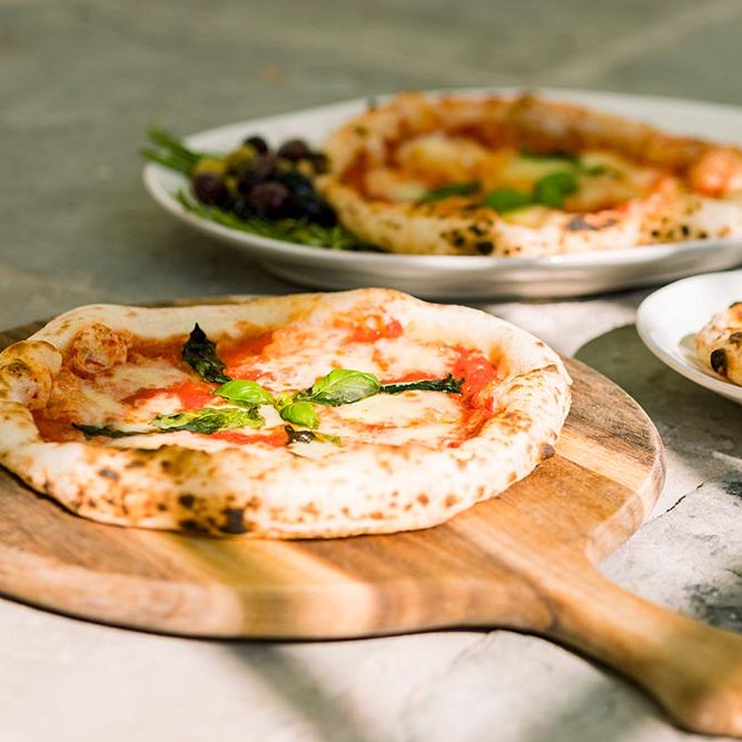Wood fired pizza van at outdoor wedding 