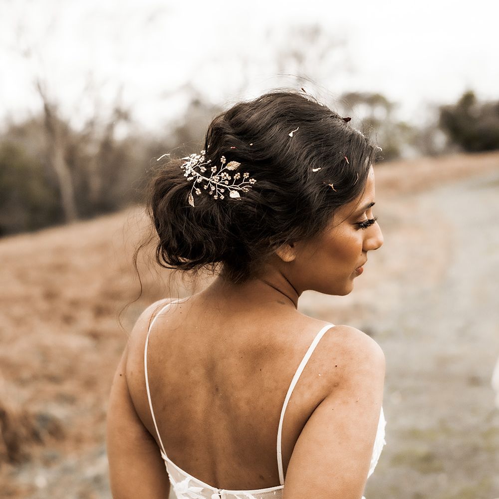 Indian Bride with a pinned up do and hair vine 
