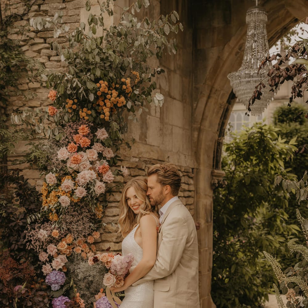 Summer wedding inspiration at Euridge Manor with Made With Love dresses, orange, coral, pink and peach flowers and iridescent tableware 
