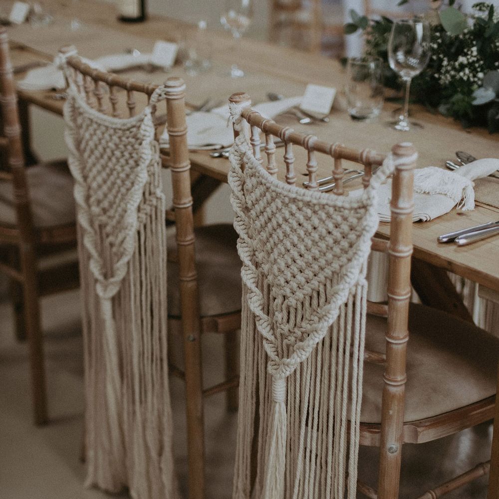 Two bamboo chairs with macrame chair hangings for Isle of Wight wedding with macrame wedding decor