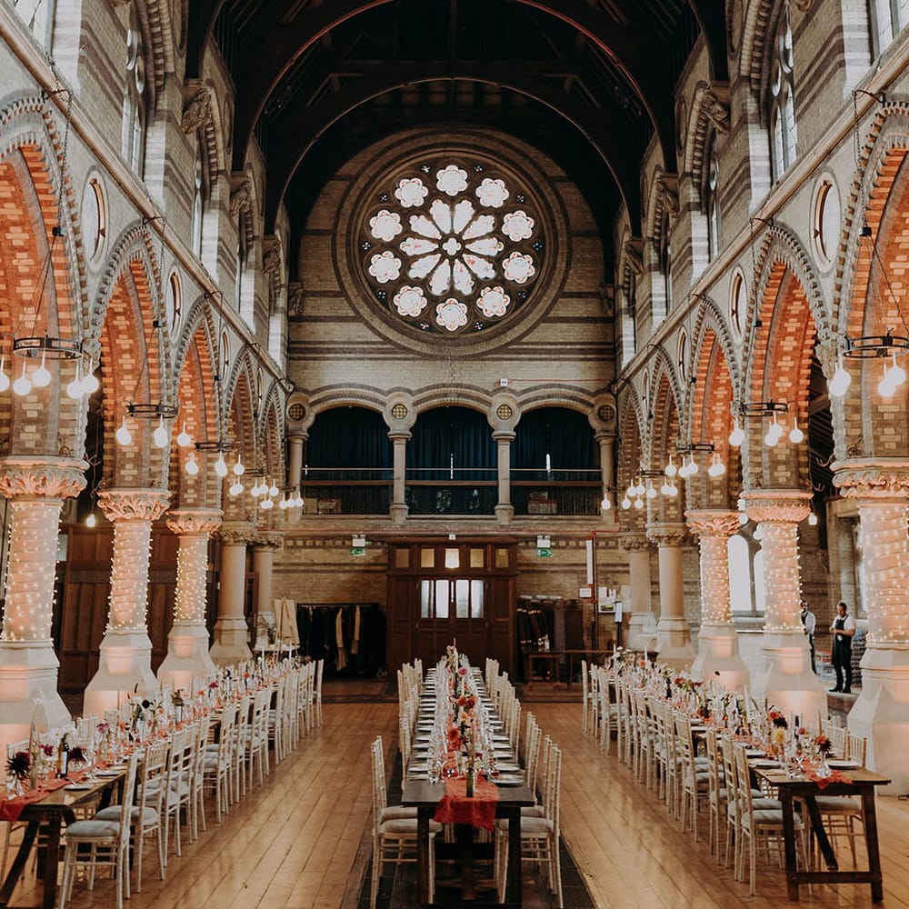 Grand church for wedding reception complete with wooden tables 
