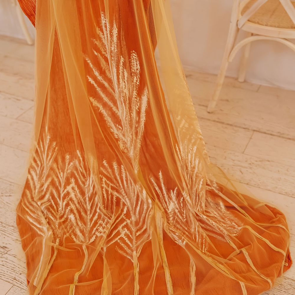 Orange linen and patterned golden wedding veil 